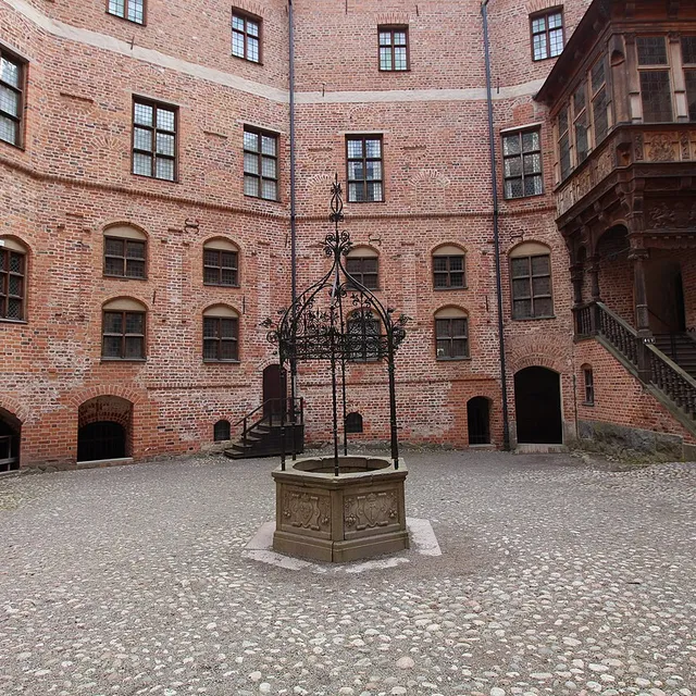 The red-brick courtyard of Gripsholm Castle with its round towers