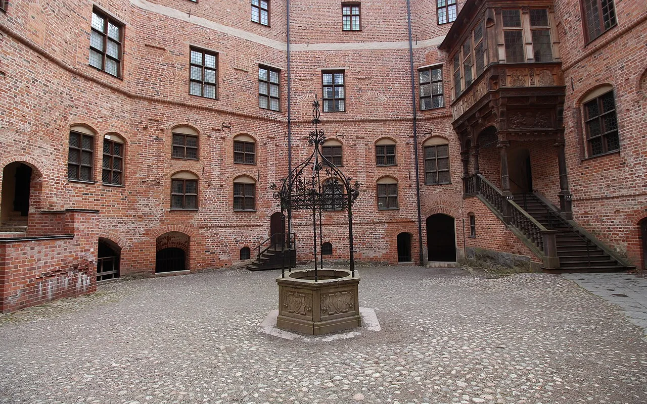 The red-brick courtyard of Gripsholm Castle with its round towers