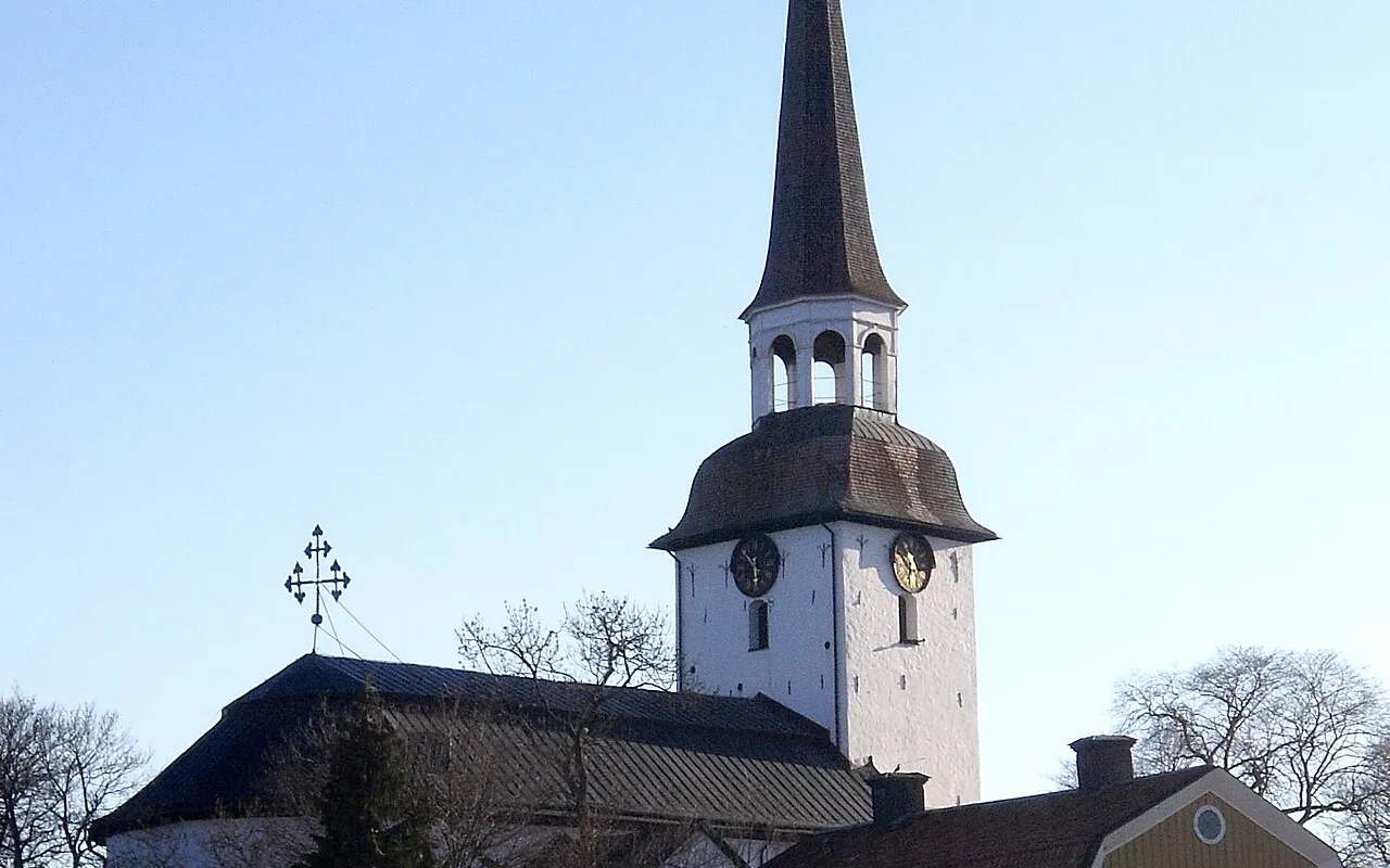 Mariefred's church and timber streets beside Gripsholm Castle